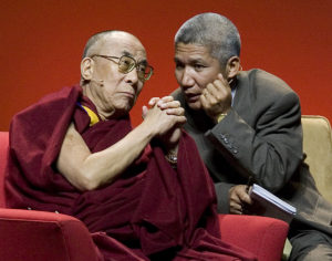 His Holiness the Dalai Lama listens to his interpreter, Dr. Thupen Jinpa Photograph by Stephen Brashear/Getty Images