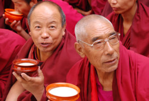Monks drinking yak butter tea while watching Cham dance at Tashilhunpo Monastery - Shigatse, Tibet - High Road to Lhasa Trip Sept 2006
